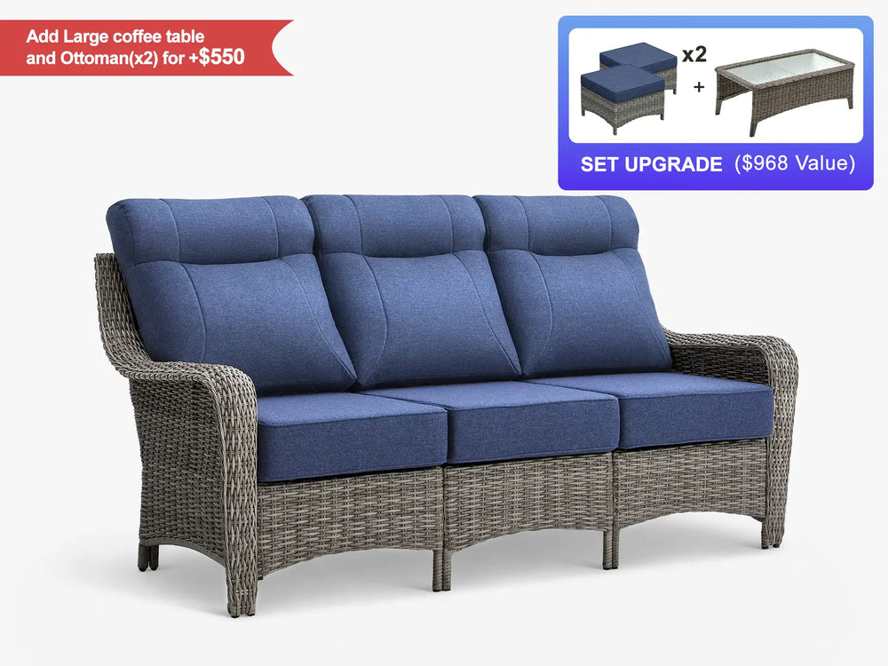 OuterCraft 3-seater outdoor wicker sofa with blue cushions styled on a luxury patio with fireplace and pergola.