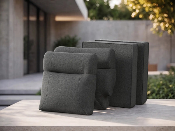 Deconstructed view of OuterCraft 4-piece modular replacement cushion suite featuring ergonomic backrests and seat bases in dark gray weather-resistant Olefin fabric