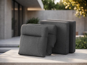 Deconstructed view of OuterCraft 4-piece modular replacement cushion suite featuring ergonomic backrests and seat bases in dark gray weather-resistant Olefin fabric