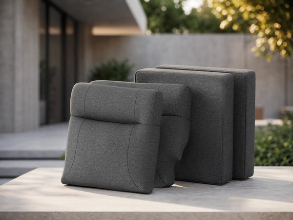 Deconstructed view of OuterCraft 4-piece modular replacement cushion suite featuring ergonomic backrests and seat bases in dark gray weather-resistant Olefin fabric