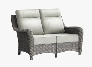 OuterCraft dark PE rattan outdoor loveseat with 6-inch thick light gray cushions on clean white background.