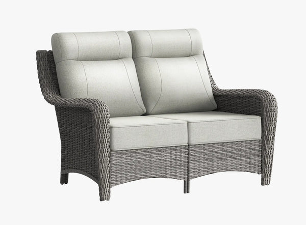 OuterCraft dark PE rattan outdoor loveseat with 6-inch thick light gray cushions on clean white background.