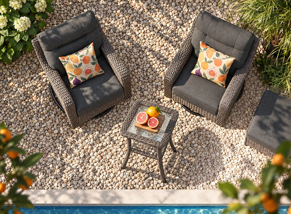 OuterCraft dark PE rattan swivel chairs, side table, ottoman, and dark gray cushions styled by a poolside patio.