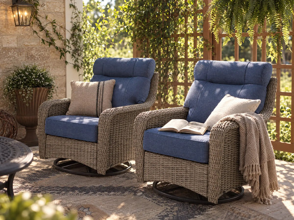 OuterCraft dark PE rattan swivel rocker chairs with blue cushions on a luxury patio deck.