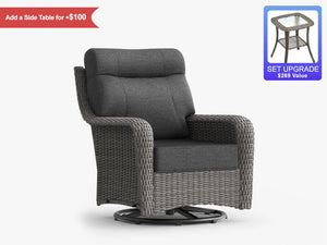 OuterCraft dark rattan swivel rocker chair with dark gray cushions and side table upgrade on white.