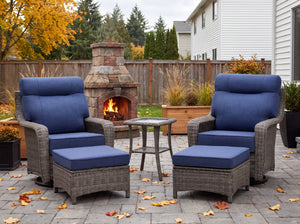 OuterCraft dark PE rattan patio set featuring 360-degree swivel chairs, ottomans, and blue cushions on estate patio.