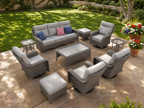 OuterCraft 10-piece dark PE rattan patio furniture set with 3-seater sofas, swivel rocker chairs, ottomans and light gray cushions styled on a grand estate patio