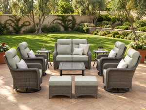 OuterCraft 10-piece dark PE rattan patio set with loveseat, 360-degree swivel rocker chairs, ottomans, side table and coffee table set with 6-inch thick light gray cushions styled on a grand estate patio