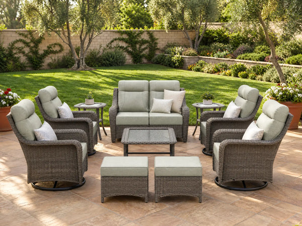 OuterCraft 10-piece dark PE rattan patio set with loveseat, 360-degree swivel rocker chairs, ottomans, side table and coffee table set with 6-inch thick light gray cushions styled on a grand estate patio