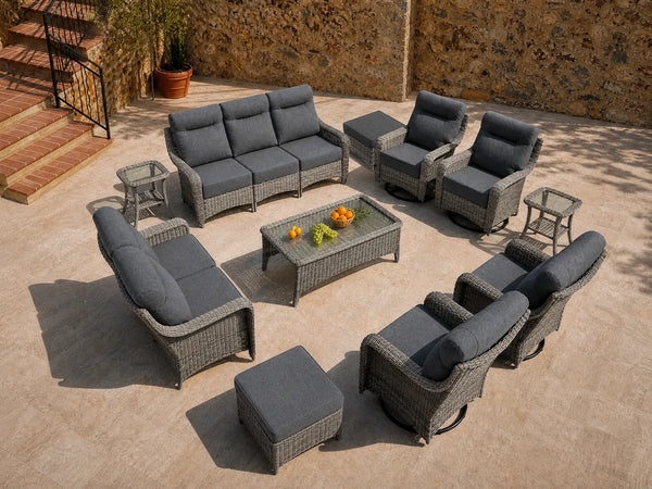 OuterCraft 11-piece dark PE rattan patio set with 3-seater sofa, loveseat, 360-degree swivel rocker chairs, ottomans, coffee table and side tables with 6-inch thick dark cushions styled on a grand estate patio