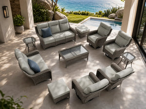 OuterCraft 11-piece dark PE rattan patio set with 3-seater sofa, loveseat, 360-degree swivel rocker chairs, ottomans, coffee table and side tables with 6-inch thick light gray cushions styled on a grand estate patio