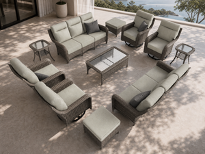 OuterCraft 11-piece dark PE rattan patio set with 3-seater sofas, 360-degree swivel rocker chairs, ottomans, coffee table and side tables with 6-inch thick light gray cushions styled on a grand estate patio