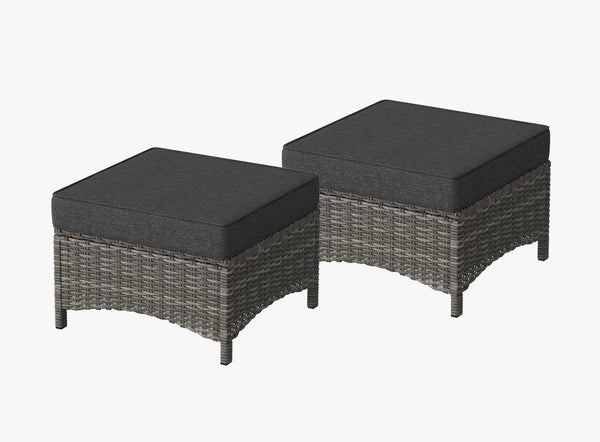OuterCraft dark PE rattan hand-woven ottomans with thick dark gray cushions on clean white background