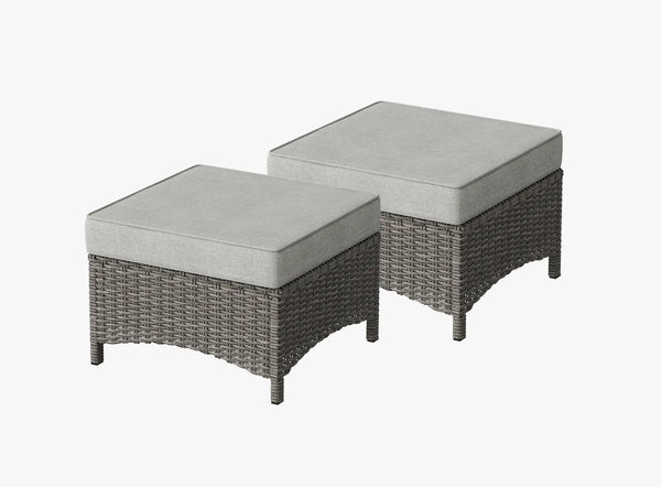 OuterCraft dark PE rattan hand-woven ottomans with thick light gray cushions on clean white background