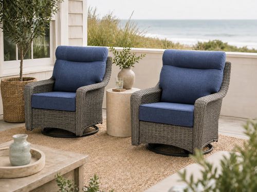OuterCraft 2-piece dark PE rattan 360-degree swivel rocker chairs and 6-inch thick blue cushions styled on a grand estate patio