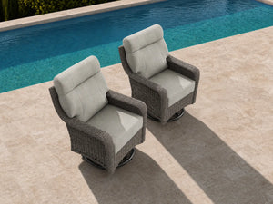 OuterCraft 2-piece dark PE rattan 360-degree swivel rocker chairs and 6-inch thick light gray cushions styled on a grand estate patio