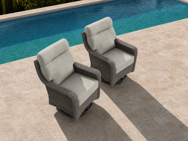 OuterCraft 2-piece dark PE rattan 360-degree swivel rocker chairs and 6-inch thick light gray cushions styled on a grand estate patio