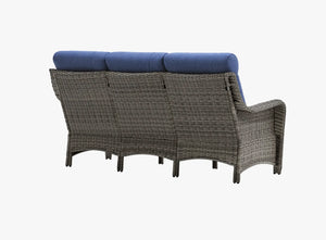 Back view of OuterCraft dark PE rattan 3-seater patio sofa with hand-woven wicker backrest and blue cushions on clean white background