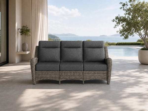 OuterCraft 3-seater all-weather dark PE wicker sofa with 6-inch thick dark gray cushions on a grand estate patio