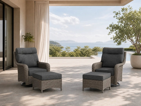 OuterCraft 4-piece dark PE rattan 360-degree swivel rocker chairs with ottomans and 6-inch thick dark gray cushions styled on a grand estate patio