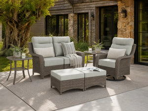 OuterCraft 6-piece dark PE rattan patio set with loveseat, 360-degree swivel rocker chairs, ottomans and side table set with 6-inch thick light gray cushions styled on a grand estate patio
