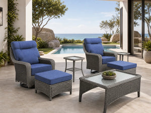 OuterCraft 7-piece dark PE rattan 360-degree swivel rocker chairs, ottomans, coffee table and side table set with 6-inch thick blue cushions on a grand estate patio