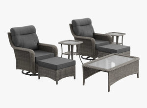OuterCraft 7-piece dark PE rattan 360-degree swivel rocker chairs, ottomans, coffee table and side table set with 6-inch thick dark gray cushions on clean white background