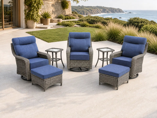 OuterCraft 7-piece dark PE rattan 360-degree swivel rocker chairs, ottomans and side table set with 6-inch thick blue cushions styled on a grand estate patio