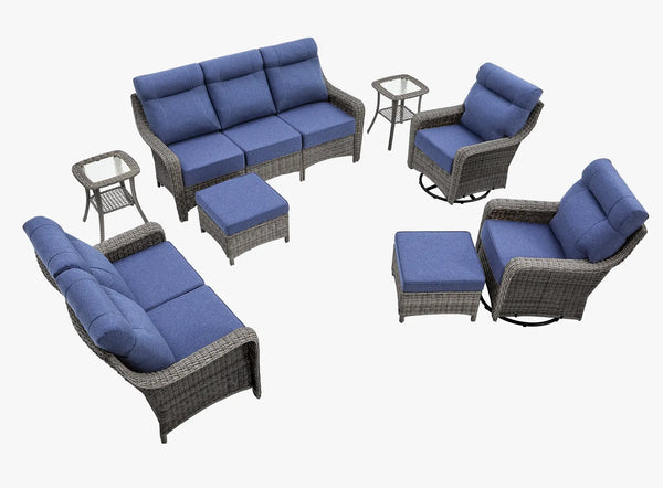 OuterCraft 8-piece dark PE rattan patio set with 3-seater sofa, loveseat with 360-degree swivel rocker chairs, ottomans and side tables set with 6-inch thick blue cushions on clean white background