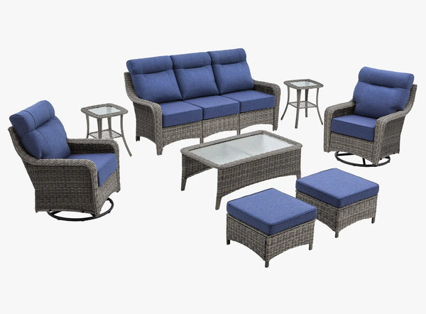 OuterCraft 8-piece dark PE rattan patio set with 3-seater sofa, 360-degree swivel rocker chairs, ottomans, side table and coffee table set with 6-inch thick blue cushions on clean white background