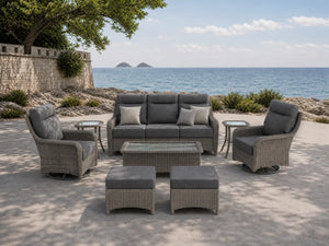 OuterCraft 8-piece dark PE rattan patio set with 3-seater sofa, 360-degree swivel rocker chairs, ottomans, side table and coffee table set with 6-inch thick dark gray cushions styled on a grand estate patio