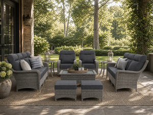 OuterCraft 9-piece dark PE rattan patio set with 3-seater sofas, 360-degree swivel rocker chairs, ottomans, coffee table and side tables with 6-inch thick dark gray cushions styled on a grand estate patio