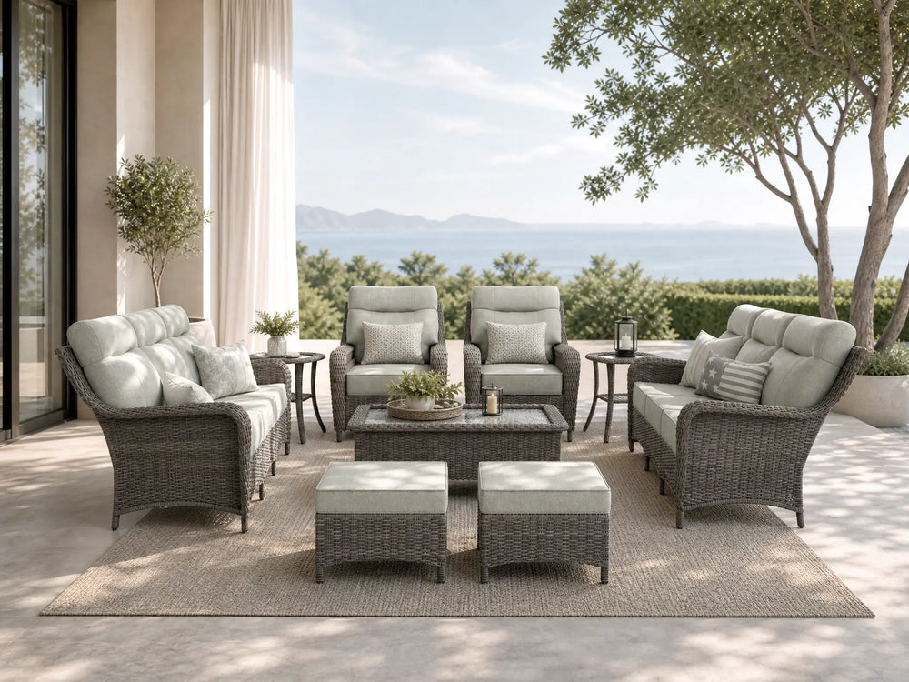 OuterCraft 9-piece dark PE rattan patio set with 3-seater sofas, 360-degree swivel rocker chairs, ottomans, coffee table and side tables with 6-inch thick light gray cushions styled on a grand estate patio