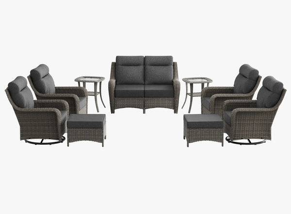 OuterCraft 9-piece dark PE rattan patio set with loveseat, 360-degree swivel rocker chairs, ottomans and side table set with 6-inch thick dark gray cushions on clean white background