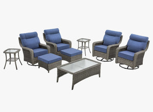 OuterCraft 9-piece dark PE rattan patio set with 360-degree swivel rocker chairs, ottomans, coffee table and side table set with 6-inch thick blue cushions on clean white background