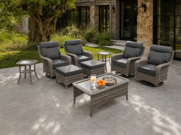 OuterCraft 9-piece dark PE rattan patio set with 360-degree swivel rocker chairs, ottomans, coffee table and side table set with 6-inch thick dark gray cushions styled on a grand estate patio