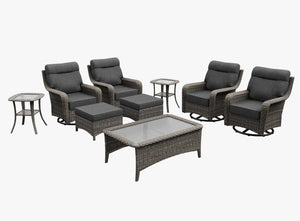 OuterCraft 9-piece dark PE rattan patio set with 360-degree swivel rocker chairs, ottomans, coffee table and side table set with 6-inch thick dark gray cushions on clean white background