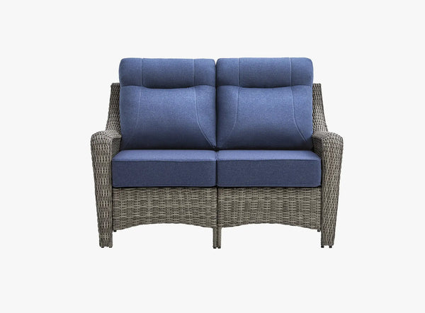 OuterCraft all-weather dark PE rattan loveseat and 6-inch thick blue cushions on clean white background