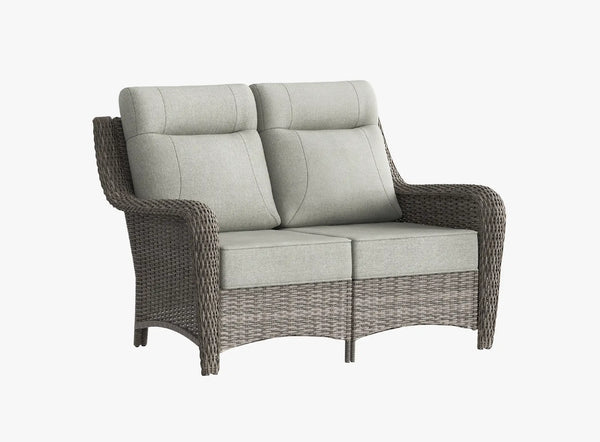 OuterCraft all-weather dark PE rattan loveseat and 6-inch thick light gray cushions on clean white background