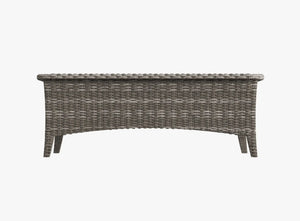 Macro product detail showcasing the tight-weave, premium dark resin wicker texture of an OuterCraft Monolith outdoor furniture piece, engineered for all-weather durability and high-end aesthetic precision.