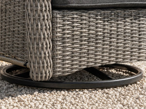 Close-up of OuterCraft swivel rocker chair heavy-duty metal base and hand-woven dark gray PE wicker corner trim