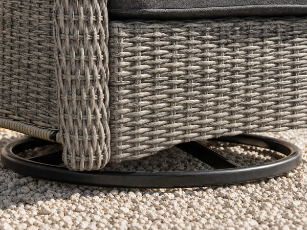 Close-up of OuterCraft swivel rocker chair heavy-duty metal base and hand-woven dark gray PE wicker corner trim