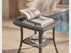 OuterCraft Monolith outdoor side table product demonstration video highlighting hand-woven charcoal resin wicker, tempered glass tabletop, lower storage shelf, and all-weather durability on a luxury resort patio.